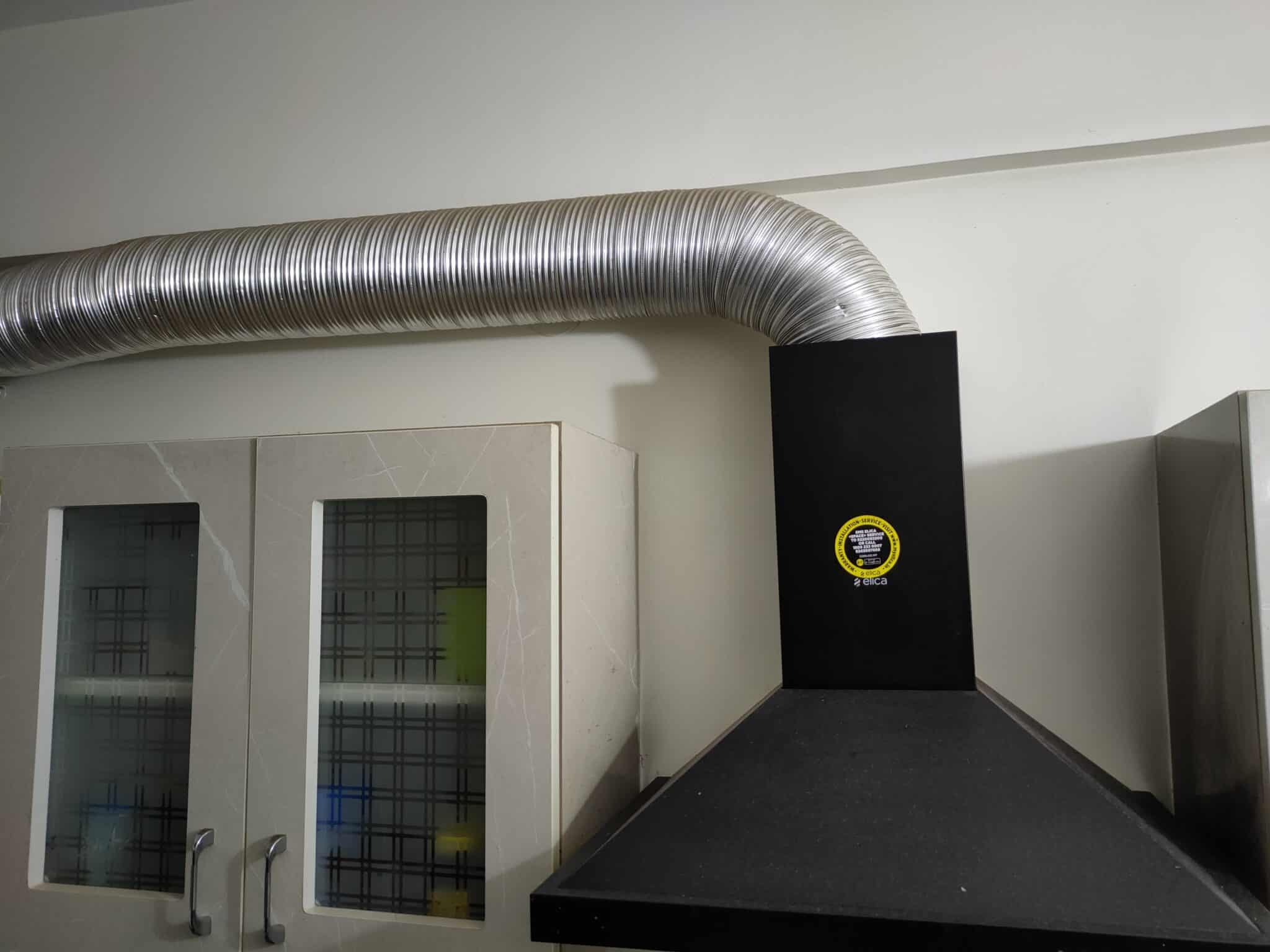 How to Conceal Chimney Exhaust Pipe in Modular Kitchen? Fi Interiors
